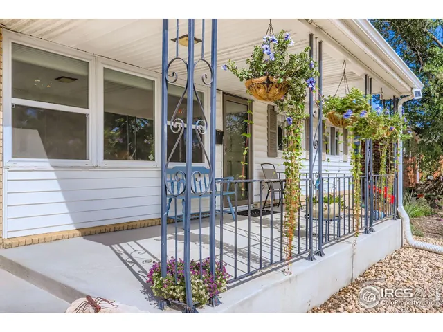 a view of a house with a flower garden