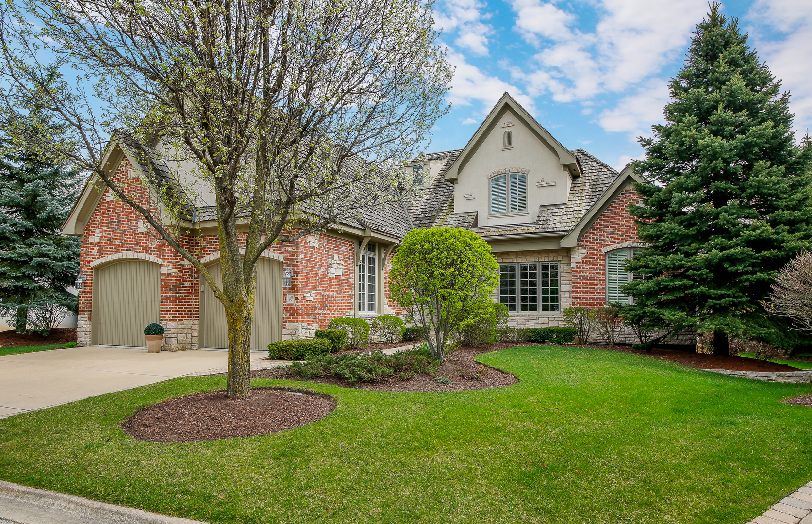 59 Forest Gate Circle Oak Brook, IL 60523 - Photo 1 of 30 a front view of house with yard and green space