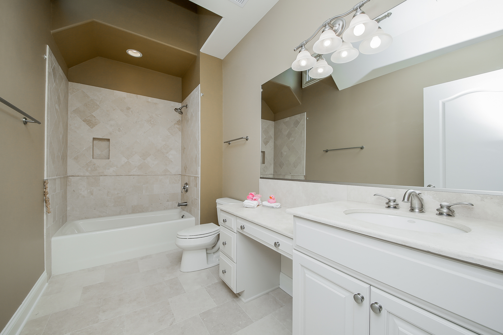 59 Forest Gate Circle Oak Brook, IL 60523 - Photo 23 of 30 a bathroom with a sink a toilet and shower