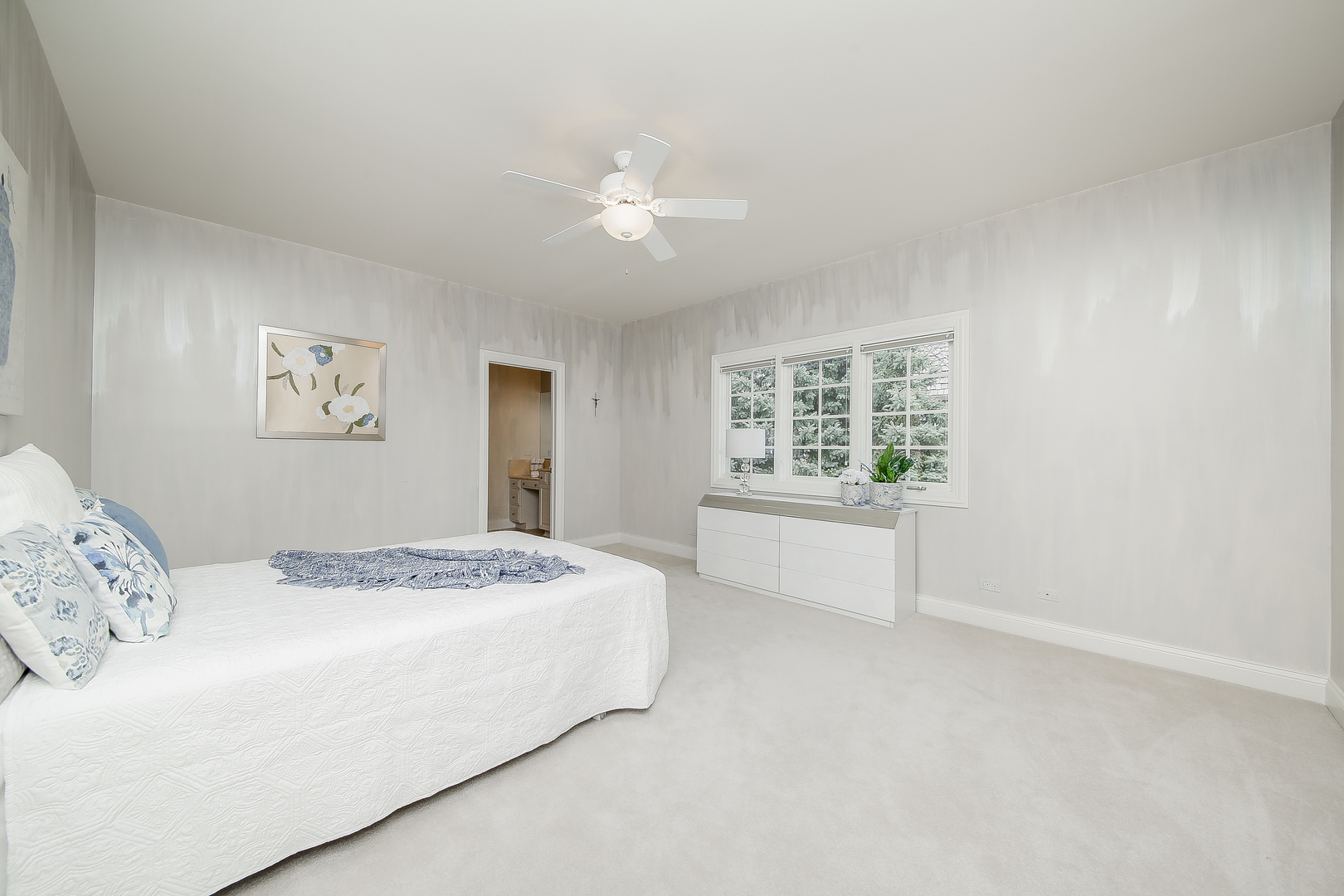 59 Forest Gate Circle Oak Brook, IL 60523 - Photo 24 of 30 a bedroom with a large bed and a window