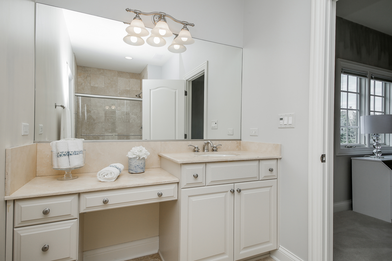 59 Forest Gate Circle Oak Brook, IL 60523 - Photo 25 of 30 a bathroom with a sink and a mirror
