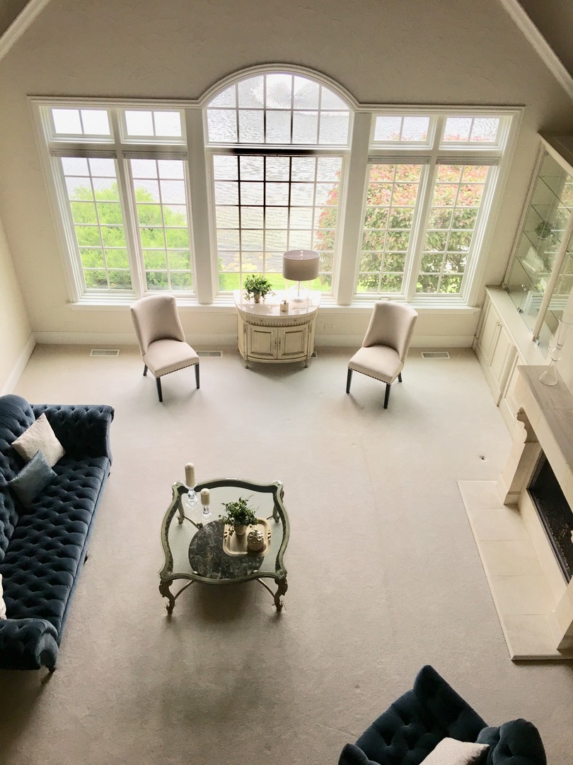 59 Forest Gate Circle Oak Brook, IL 60523 - Photo 4 of 30 a living room with furniture and floor to ceiling window