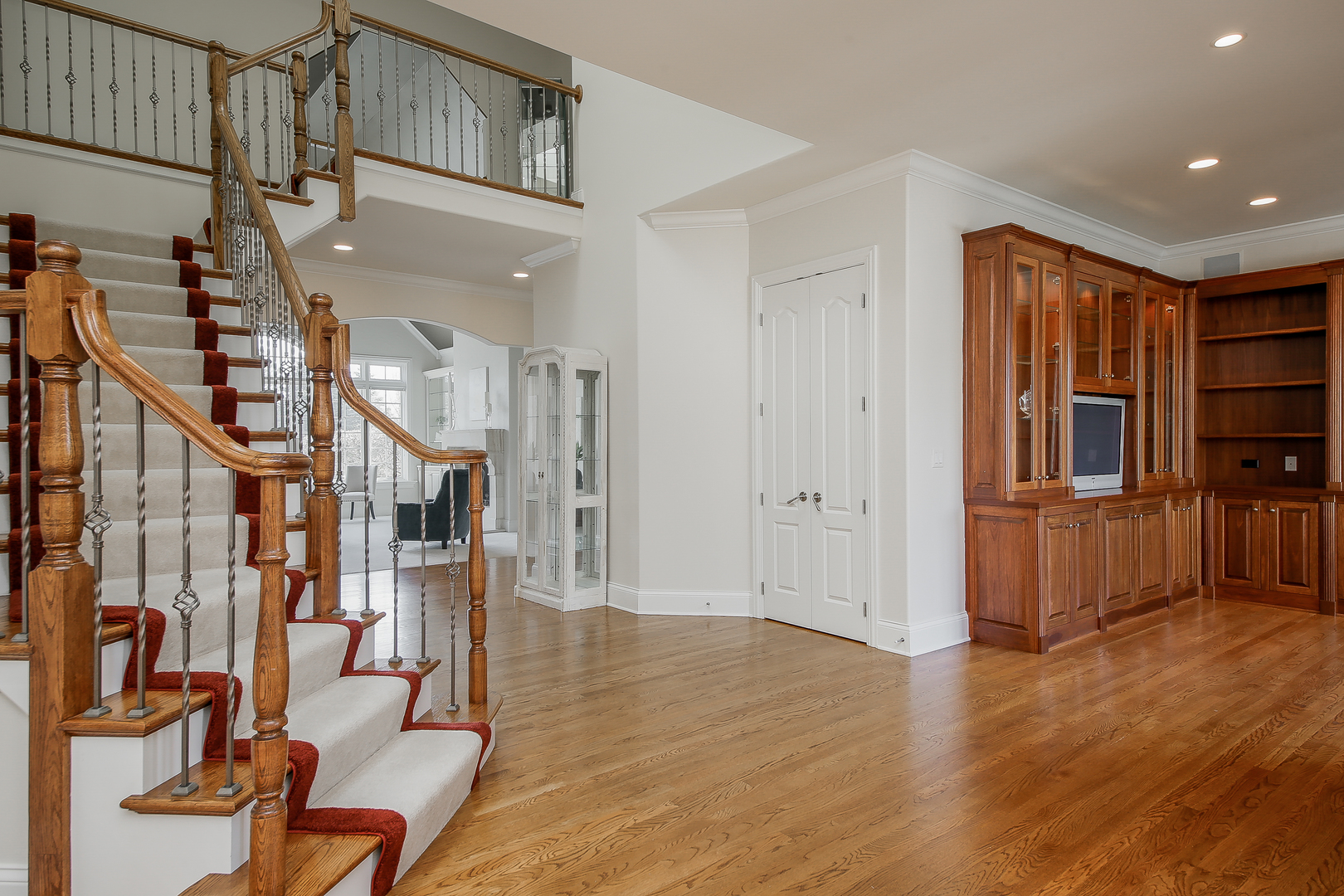59 Forest Gate Circle Oak Brook, IL 60523 - Photo 6 of 30 a view of entryway and hall with wooden floor