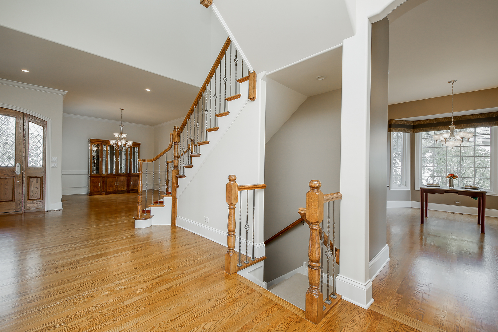 59 Forest Gate Circle Oak Brook, IL 60523 - Photo 7 of 30 a view of entryway and hall with wooden floor