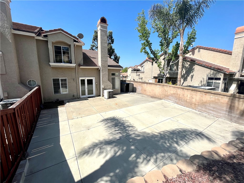 7619 Haven Avenue, Unit B Rancho Cucamonga, CA 91730 - Photo 16 of 16 a view of a house with palm trees