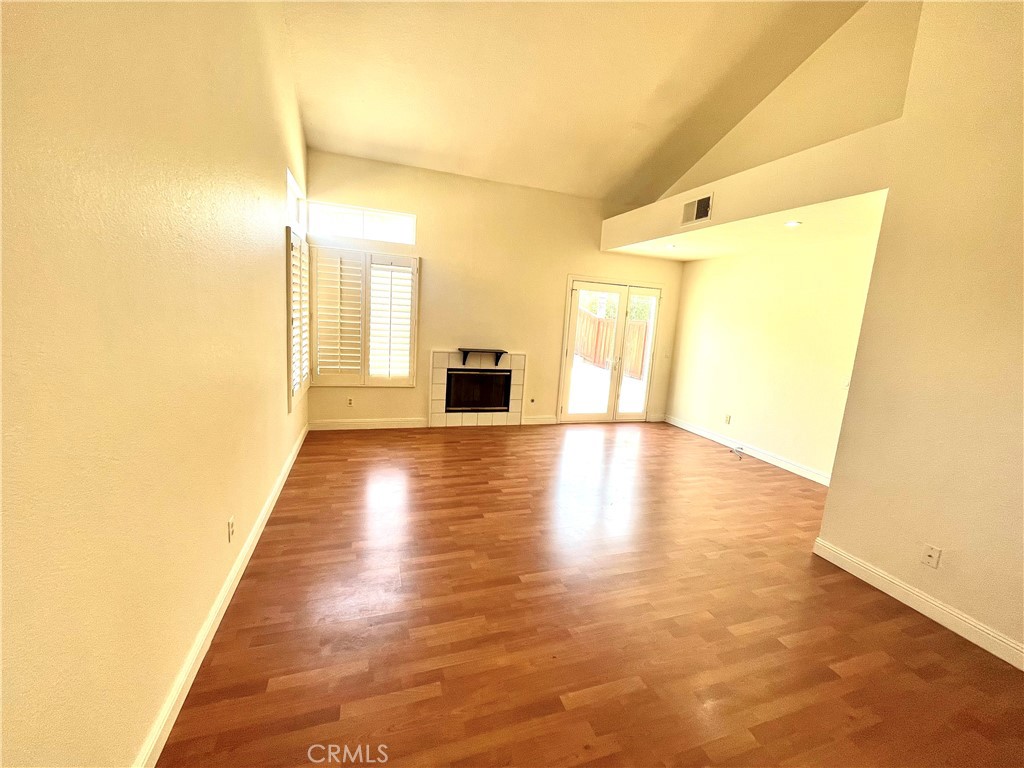 7619 Haven Avenue, Unit B Rancho Cucamonga, CA 91730 - Photo 2 of 16 a view of an entryway with wooden floor