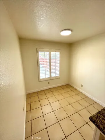 a view of an empty room and a window