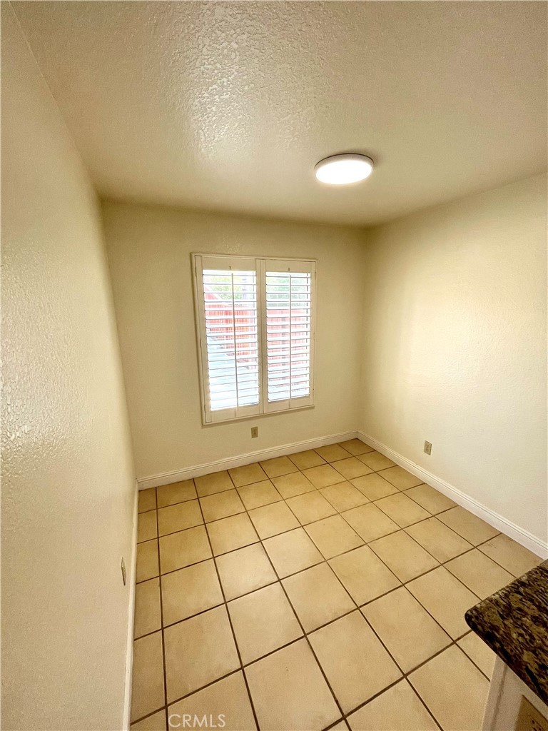 7619 Haven Avenue, Unit B Rancho Cucamonga, CA 91730 - Photo 8 of 16 a view of an empty room and a window