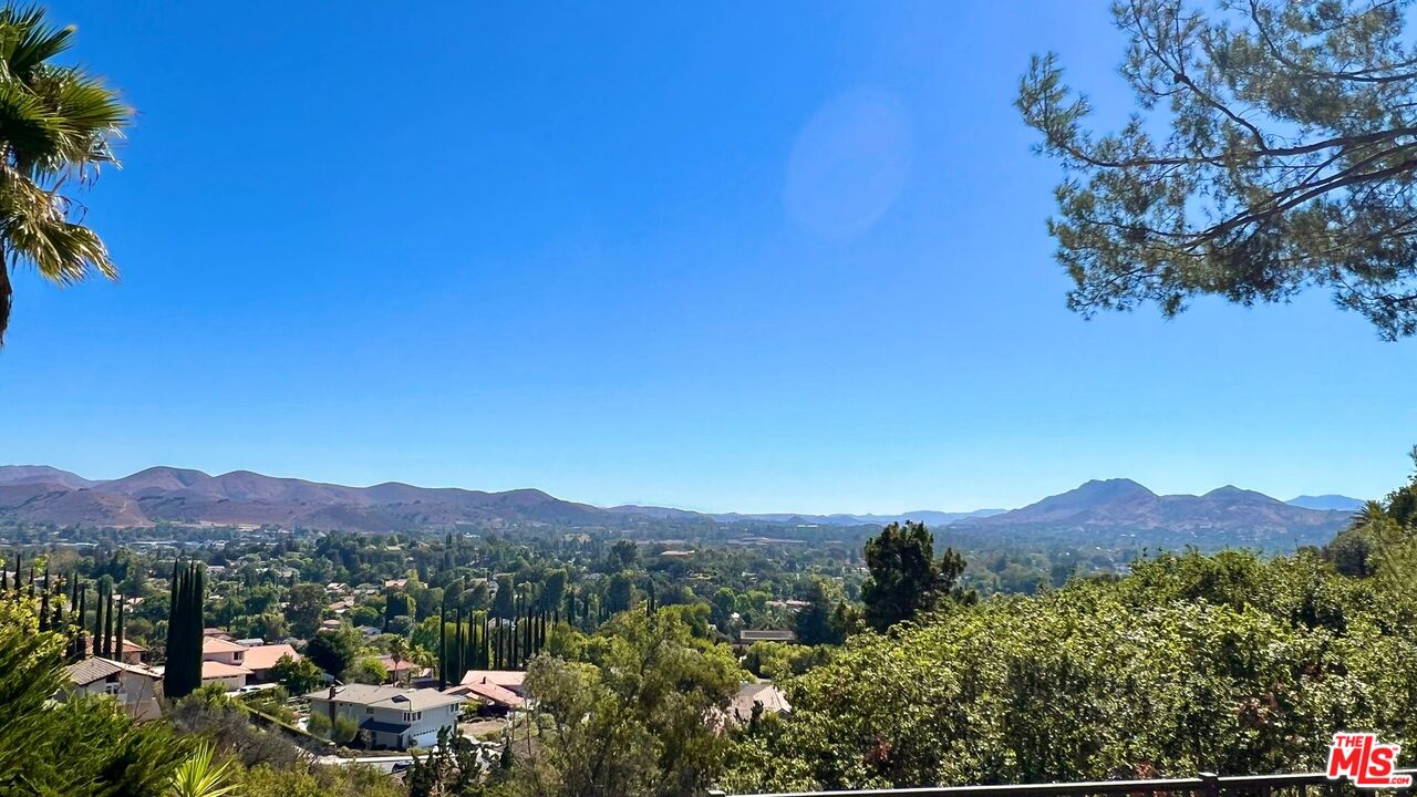1096 Stoneshead Court Westlake Village, CA 91361 - Photo 1 of 38 a view of a town with mountains in the background
