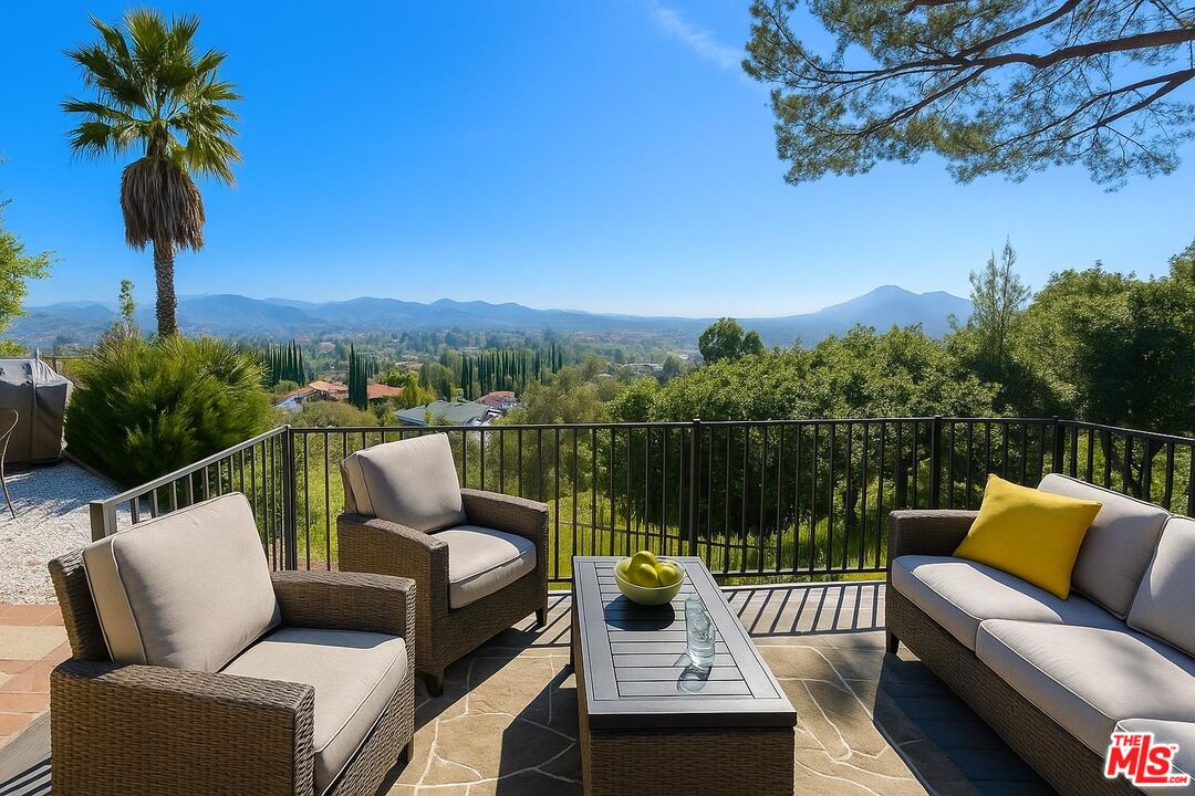 1096 Stoneshead Court Westlake Village, CA 91361 - Photo 13 of 38 a balcony with wooden floor and outdoor seating