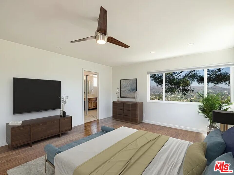 1096 Stoneshead Court Westlake Village, CA 91361 - Photo 20 of 38 a bedroom with furniture and a flat screen tv