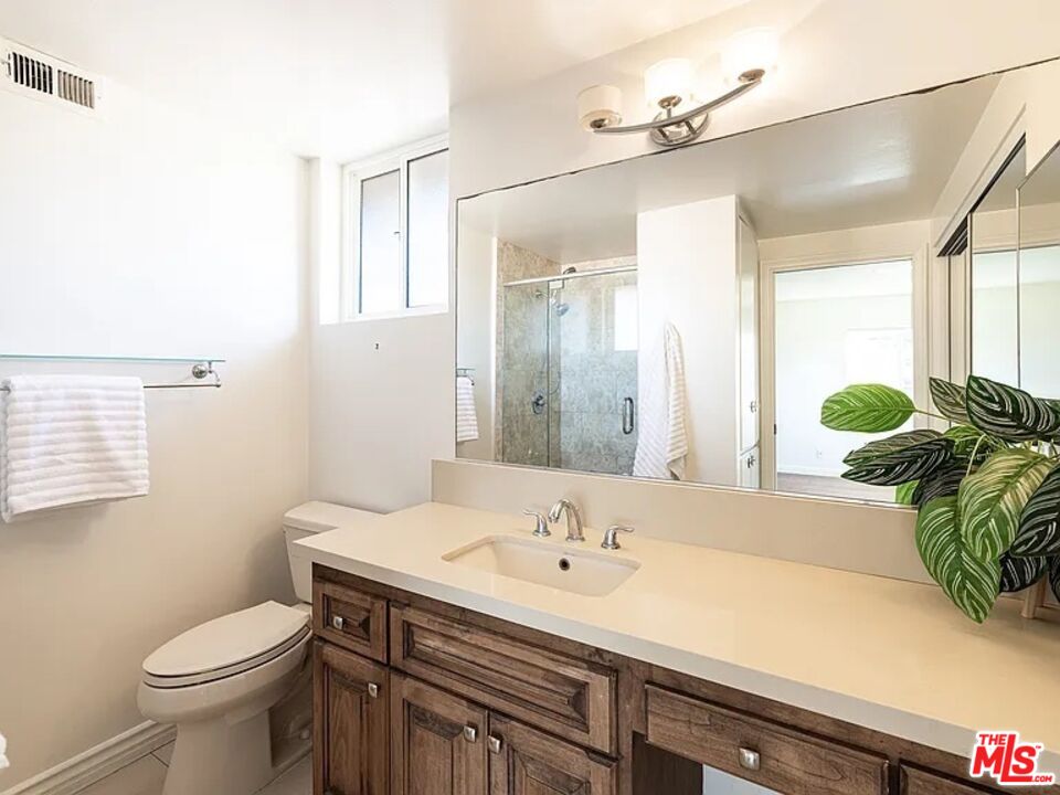 1096 Stoneshead Court Westlake Village, CA 91361 - Photo 22 of 38 a bathroom with a sink a toilet and shower