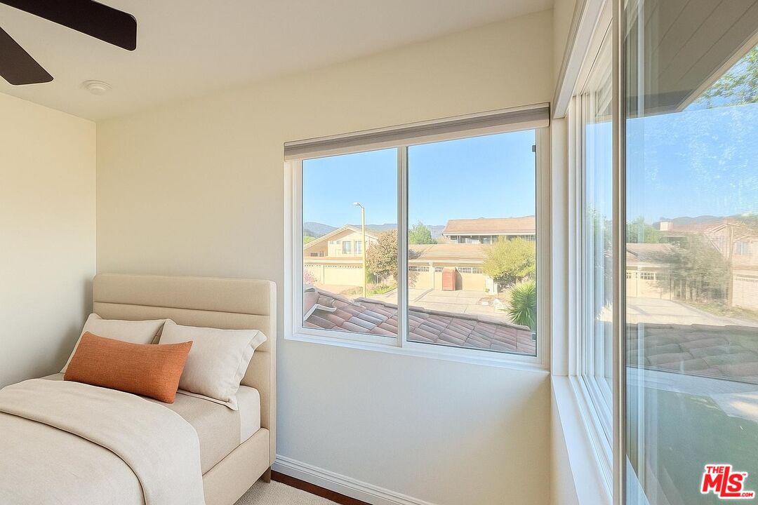 1096 Stoneshead Court Westlake Village, CA 91361 - Photo 26 of 38 a bedroom with a large window and a bed