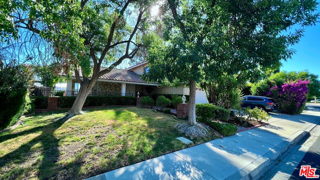 1096 Stoneshead Court Westlake Village, CA 91361 - Photo 31 of 38 a front view of a house with garden