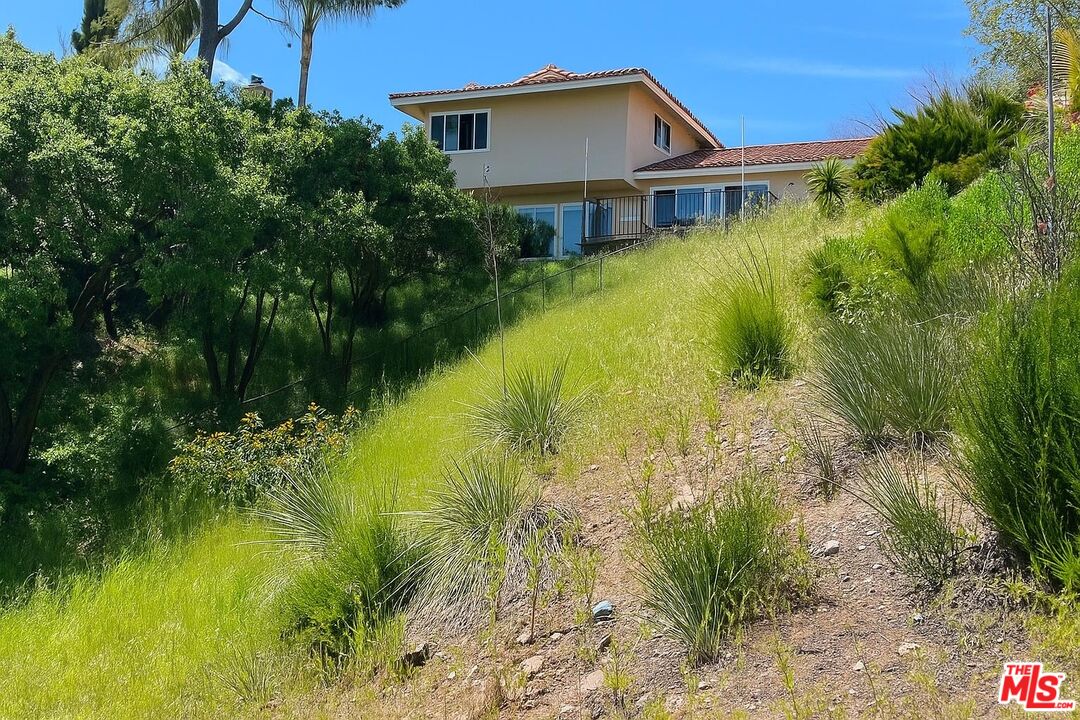 1096 Stoneshead Court Westlake Village, CA 91361 - Photo 32 of 38 a view of a house with a yard