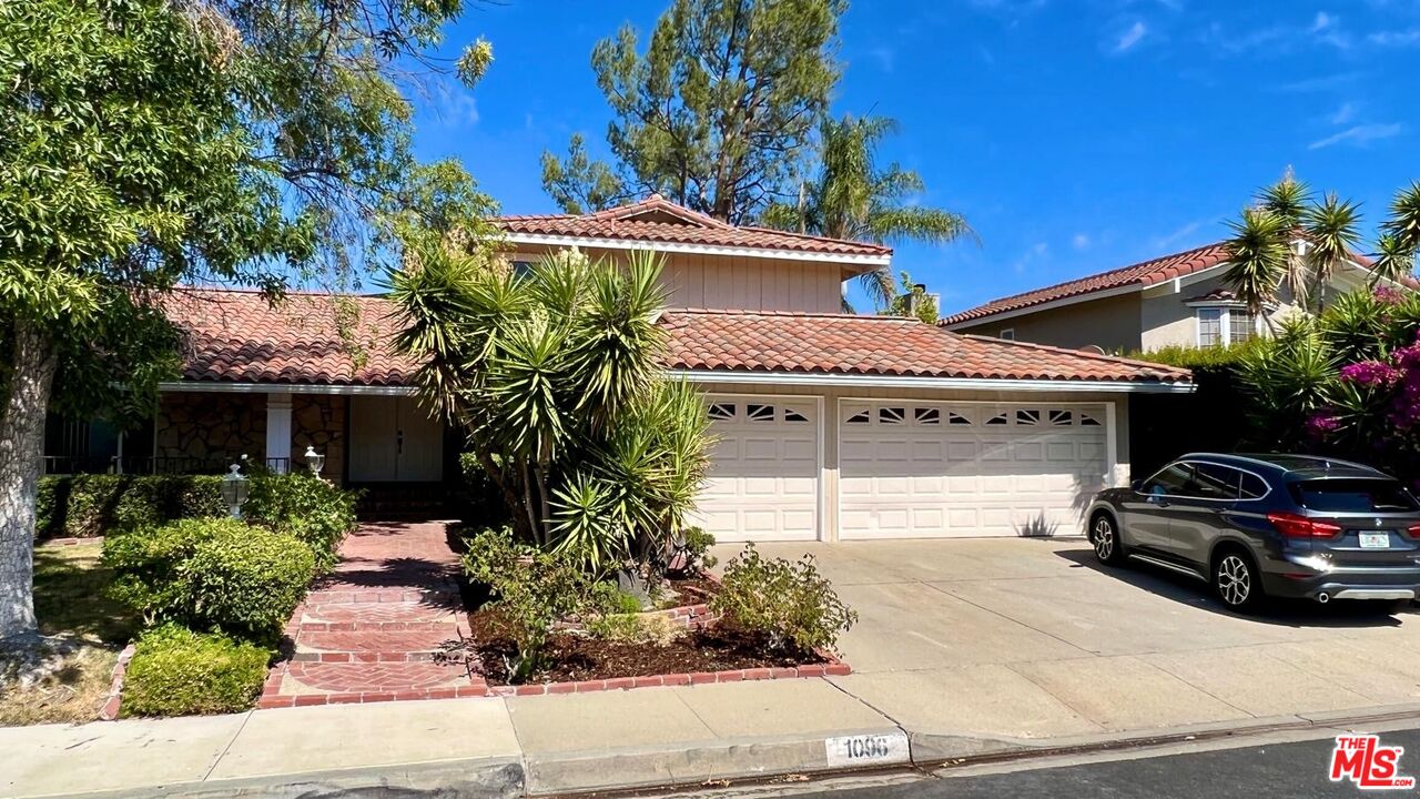 1096 Stoneshead Court Westlake Village, CA 91361 - Photo 34 of 38 a view of a car parked in front of a house