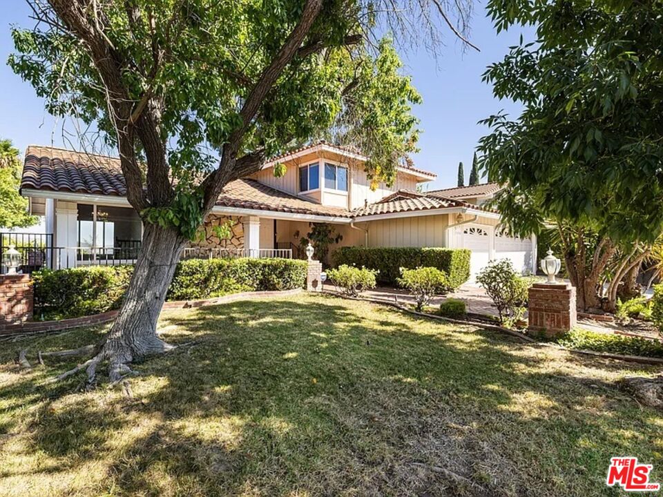 1096 Stoneshead Court Westlake Village, CA 91361 - Photo 4 of 38 a front view of a house with a yard