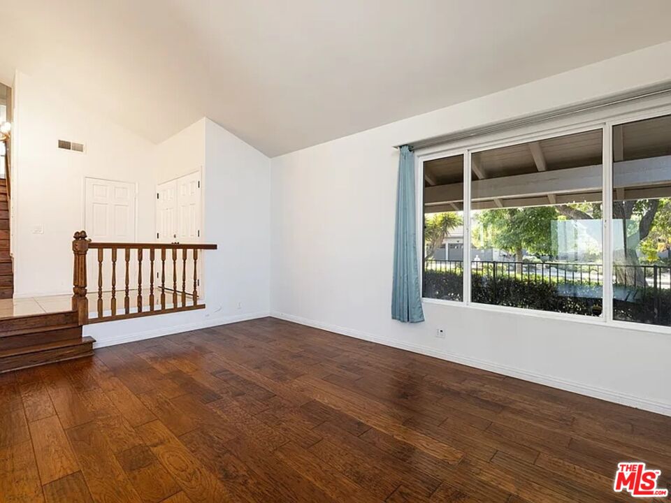 1096 Stoneshead Court Westlake Village, CA 91361 - Photo 6 of 38 a view of an empty room with wooden floor and fan