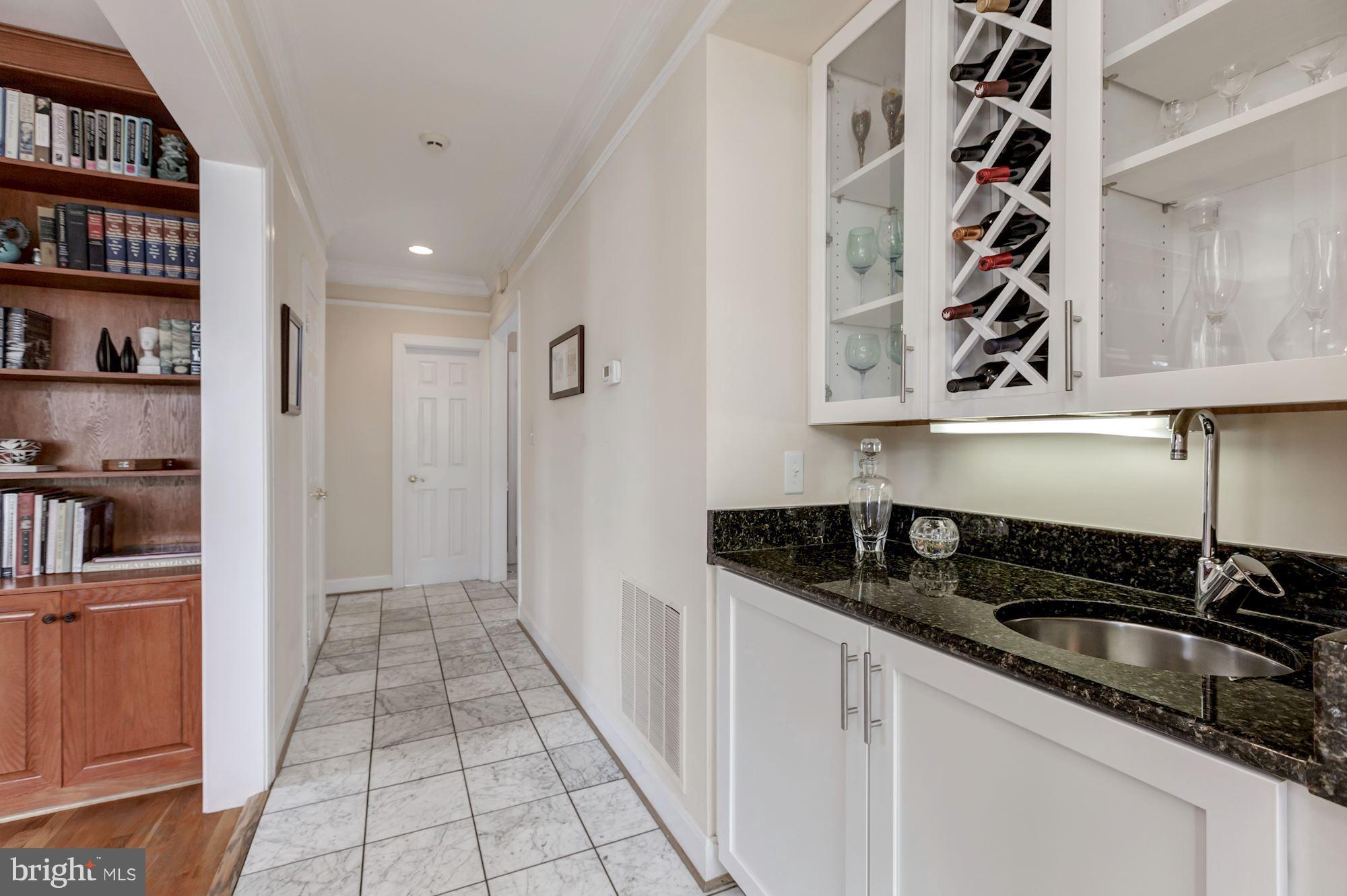8745 Hickory Bend Trail Potomac, MD 20854 - Photo 11 of 30 a kitchen with granite countertop a cabinets and a stove