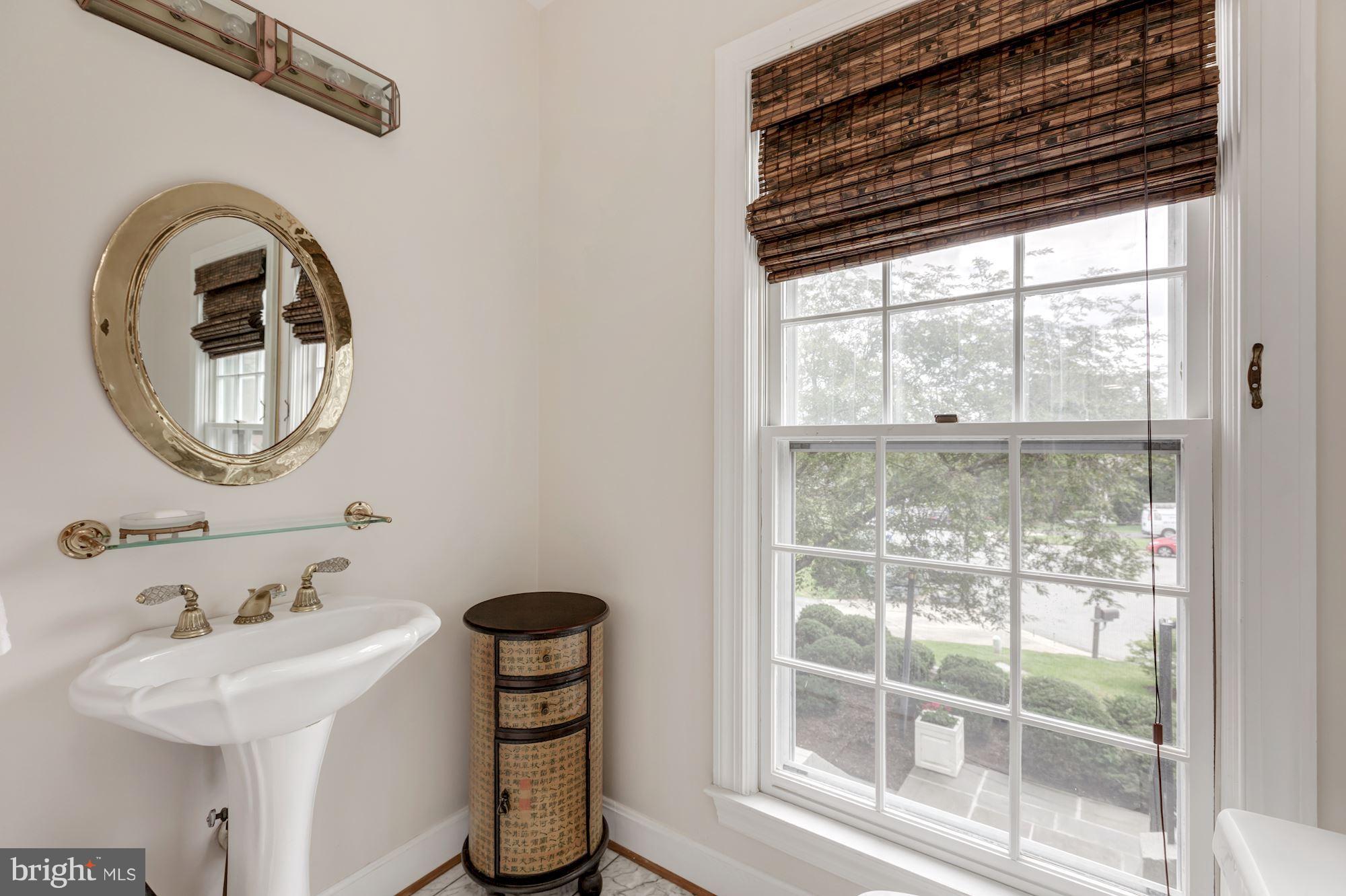 8745 Hickory Bend Trail Potomac, MD 20854 - Photo 13 of 30 a bathroom with a sink and a mirror
