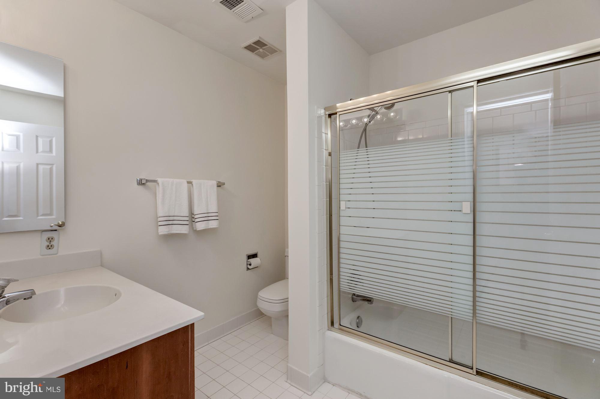 8745 Hickory Bend Trail Potomac, MD 20854 - Photo 22 of 30 a bathroom with a sink and a mirror