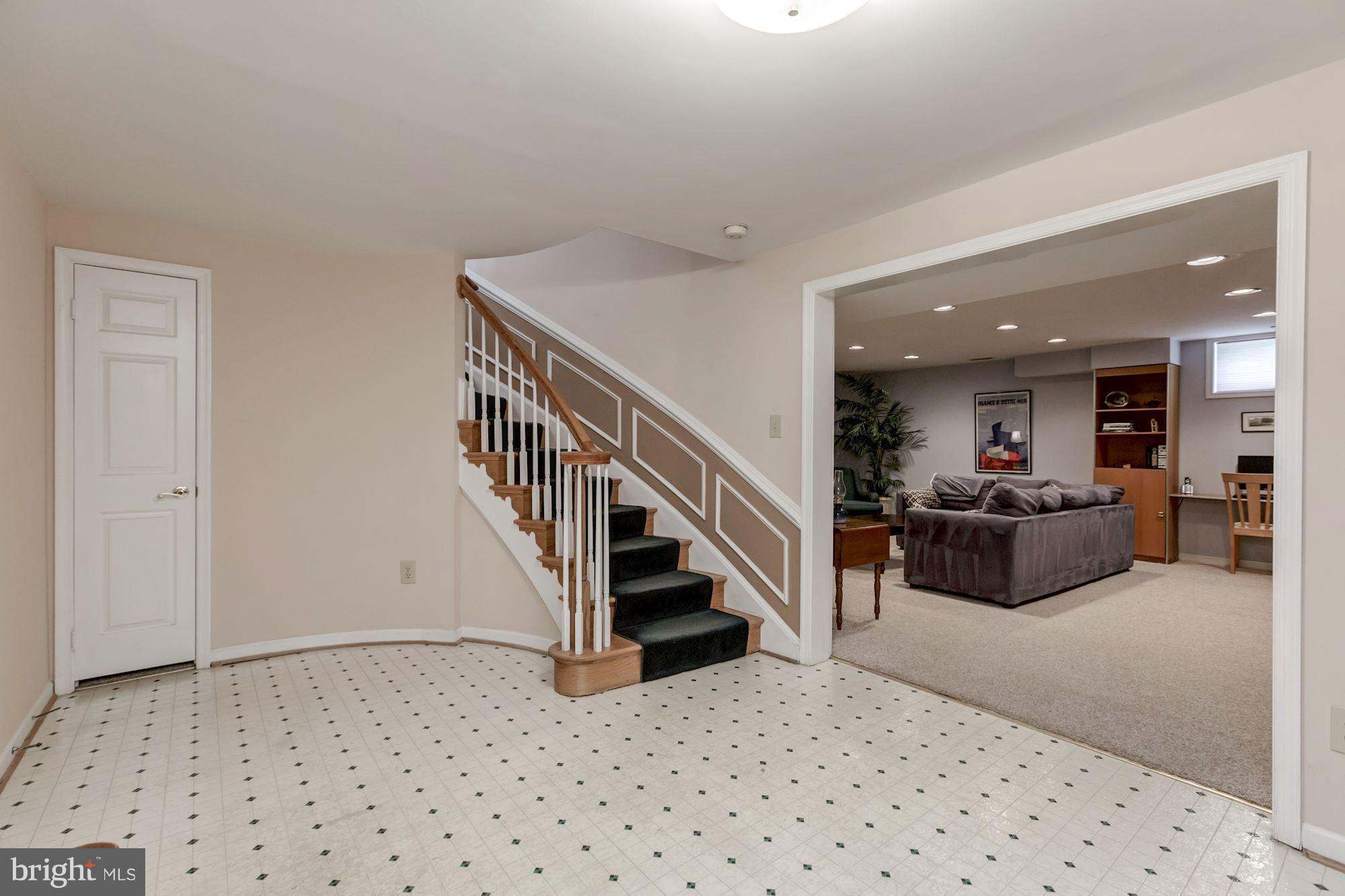 8745 Hickory Bend Trail Potomac, MD 20854 - Photo 23 of 30 a living room with furniture and a ceiling fan