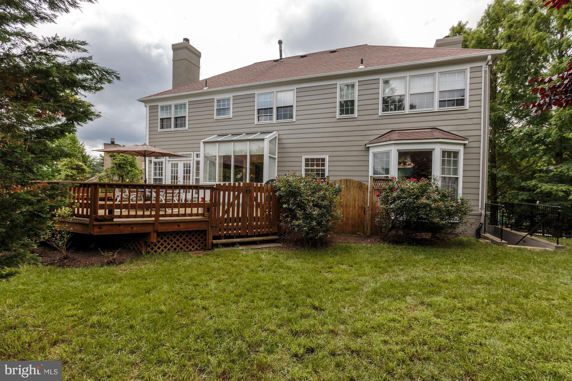 8745 Hickory Bend Trail Potomac, MD 20854 - Photo 29 of 30 a view of a house with a yard and deck