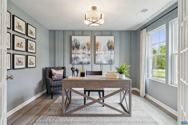 a workspace with furniture and window