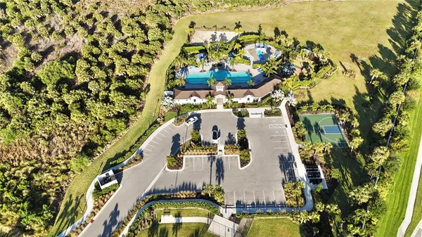 an aerial view of residential houses with outdoor space