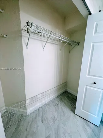 a view of an empty room and windows