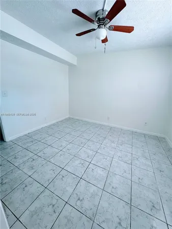 a view of a room with a mirror and a shower view