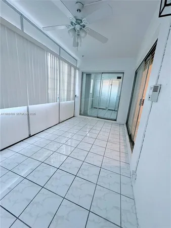 a bedroom with a bed and a television