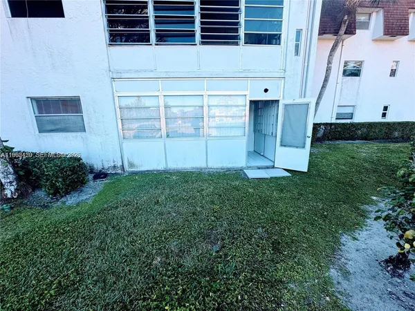 a view of a garden with houses