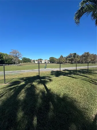 a view of swimming pool from yard