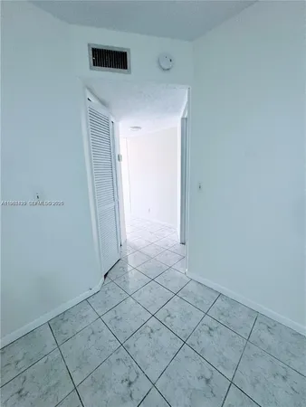 a view of a livingroom with a ceiling fan and window