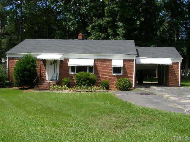 1218 Southerlund Road Garner, NC 27529 - Photo 1 of 10 a house view with a garden space