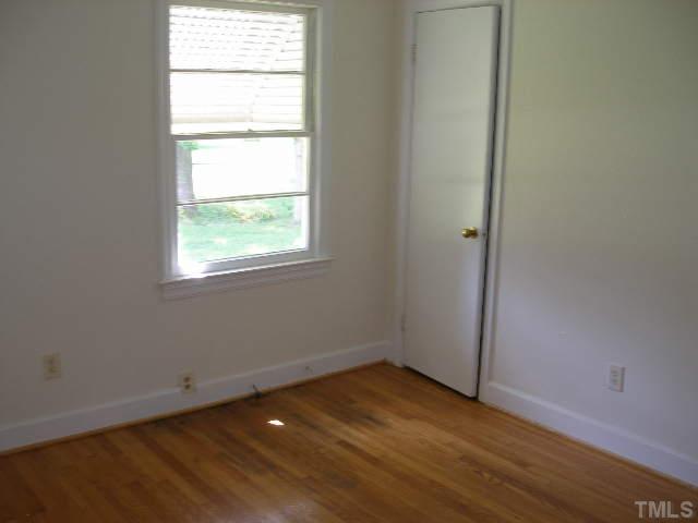 1218 Southerlund Road Garner, NC 27529 - Photo 7 of 10 an empty room with a window