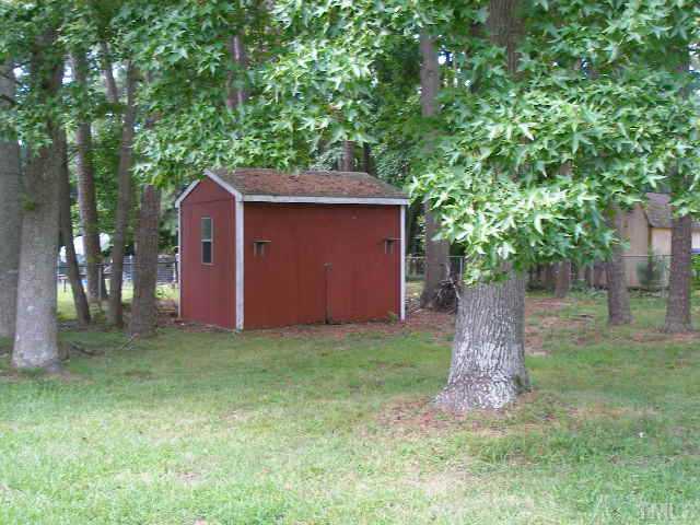 1218 Southerlund Road Garner, NC 27529 - Photo 10 of 10 a backyard of a house with lots of green space