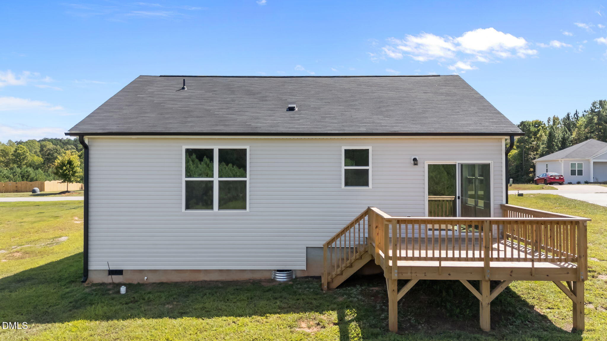 140 Brookhaven Drive Spring Hope, NC 27882 - Photo 26 of 32 a view of a house with a wooden deck and a yard