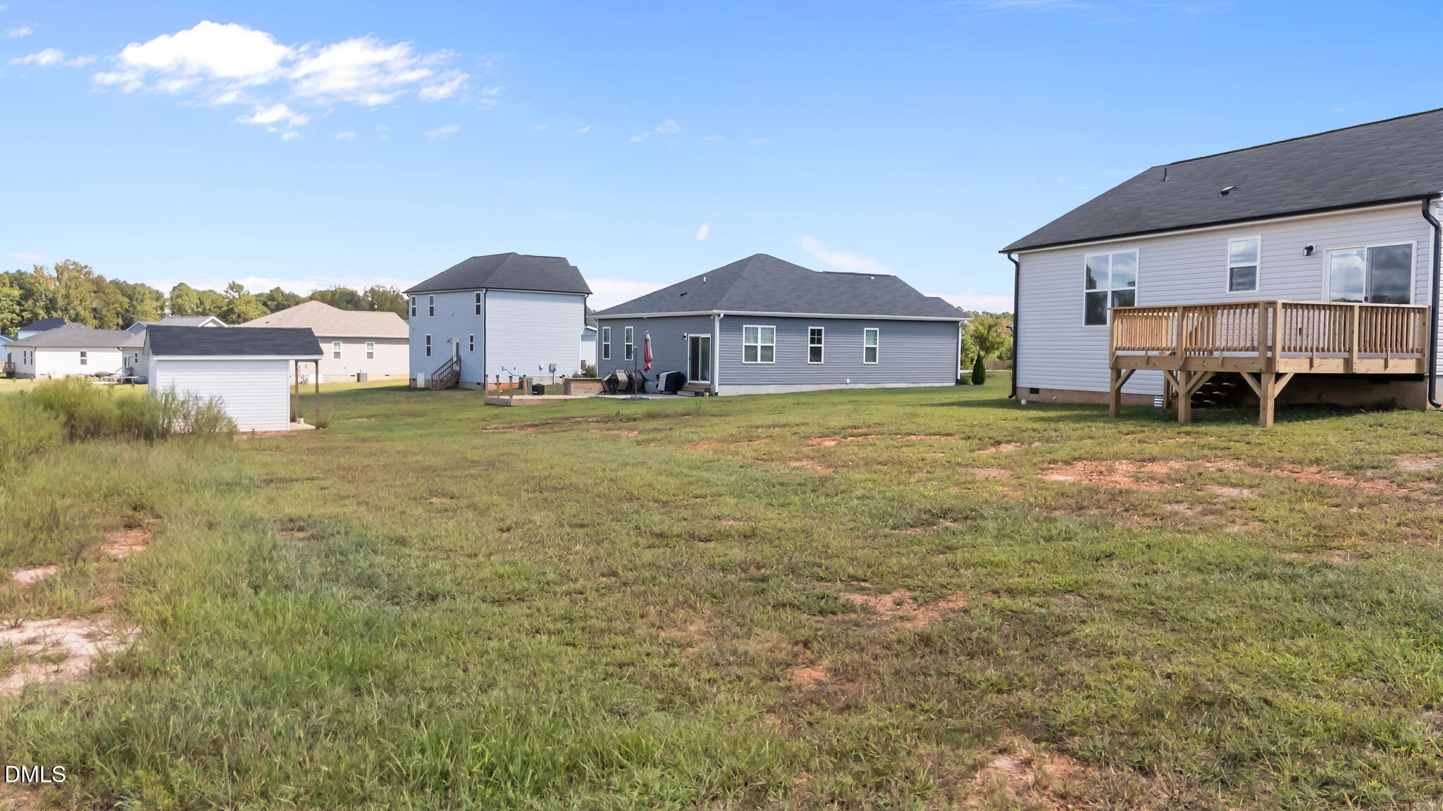 140 Brookhaven Drive Spring Hope, NC 27882 - Photo 29 of 32 a view of a big house with a big yard and large trees