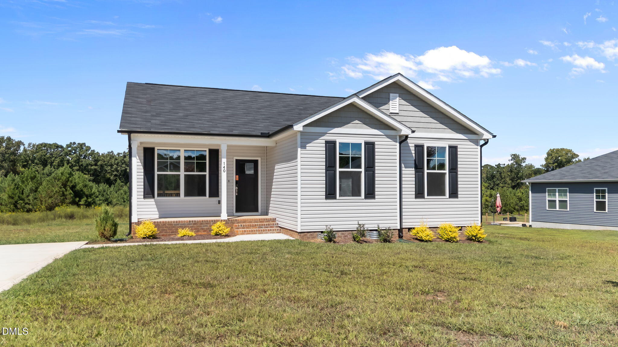 140 Brookhaven Drive Spring Hope, NC 27882 - Photo 3 of 32 a house view with a garden space