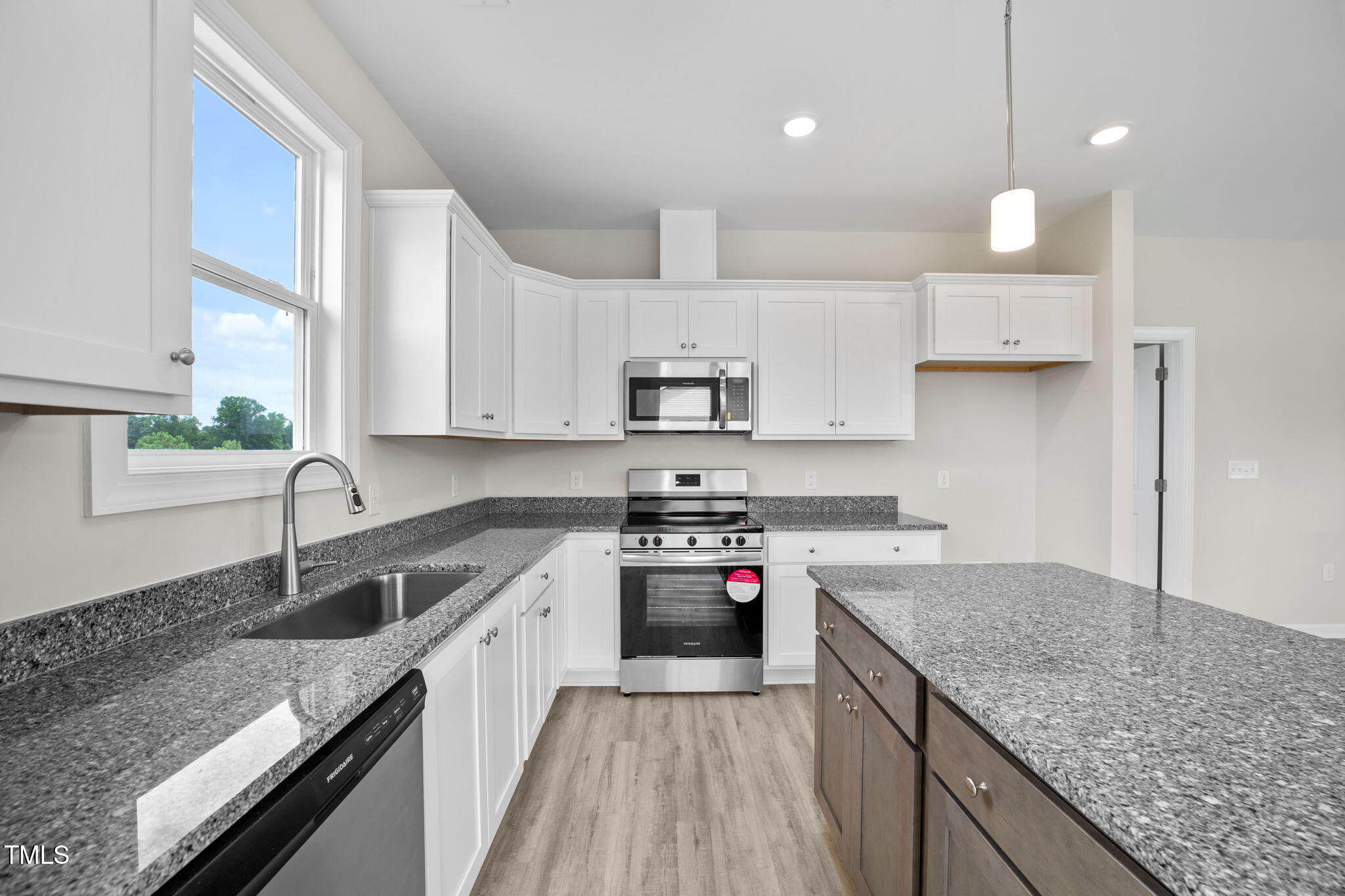 140 Brookhaven Drive Spring Hope, NC 27882 - Photo 7 of 32 a kitchen with a stove sink and cabinets