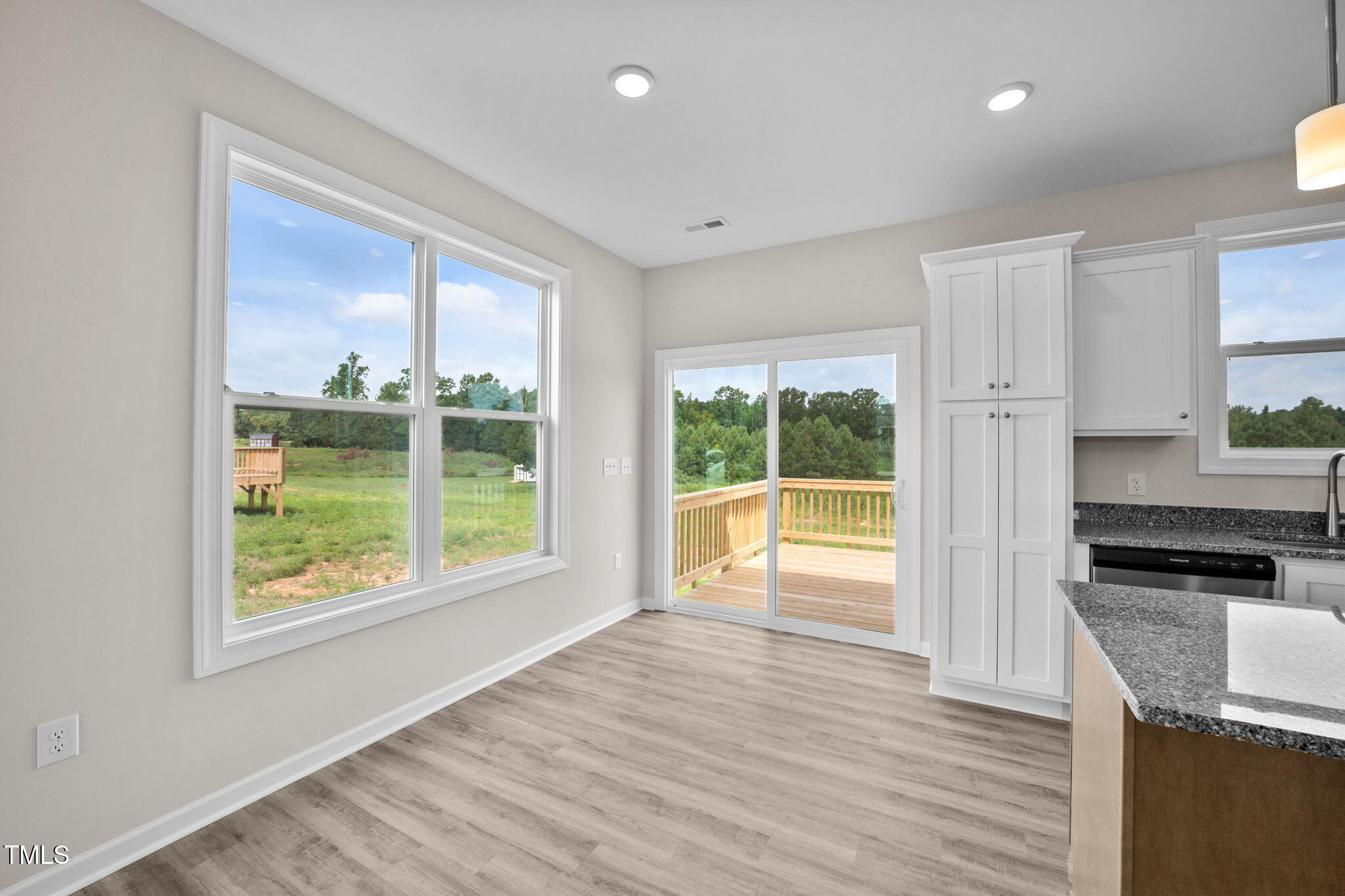 140 Brookhaven Drive Spring Hope, NC 27882 - Photo 9 of 32 a view of a kitchen with wooden floor and a window