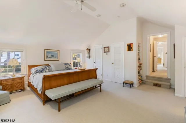 a spacious bedroom with a bed and a couch