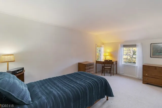 a bedroom with a bed and furniture