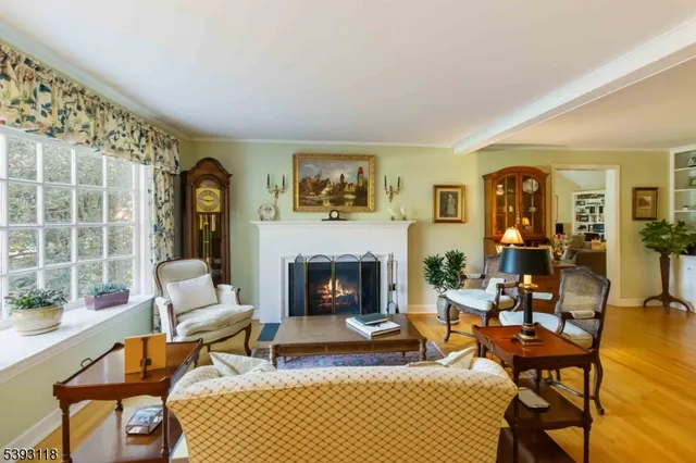 a living room with furniture fireplace and window