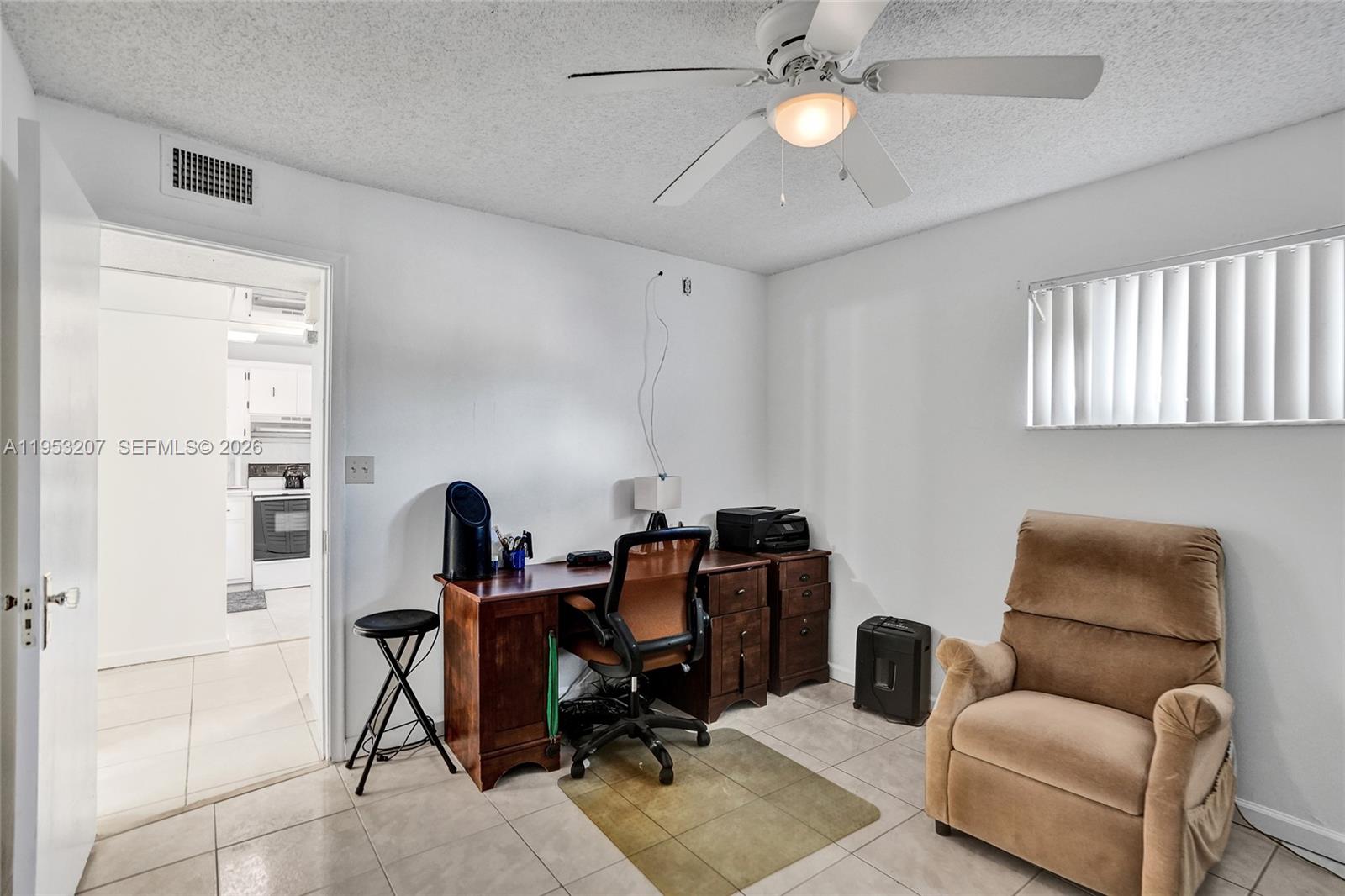 3511 Inverrary Drive, Unit 107 Lauderhill, FL 33319 - Photo 18 of 47 a view of a livingroom with furniture and a window