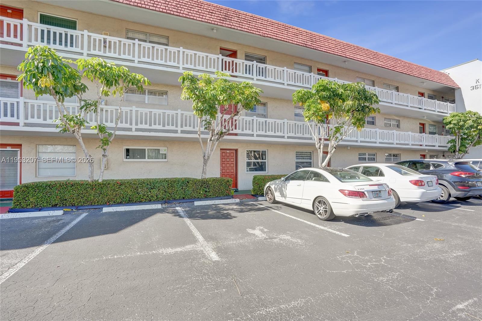 3511 Inverrary Drive, Unit 107 Lauderhill, FL 33319 - Photo 2 of 47 a view of parking with a cars park side of a road