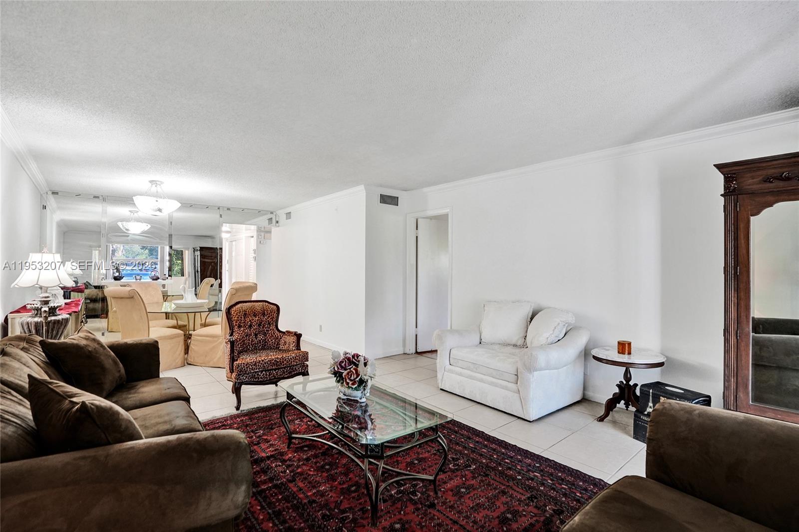 3511 Inverrary Drive, Unit 107 Lauderhill, FL 33319 - Photo 25 of 47 a living room with furniture and a couch