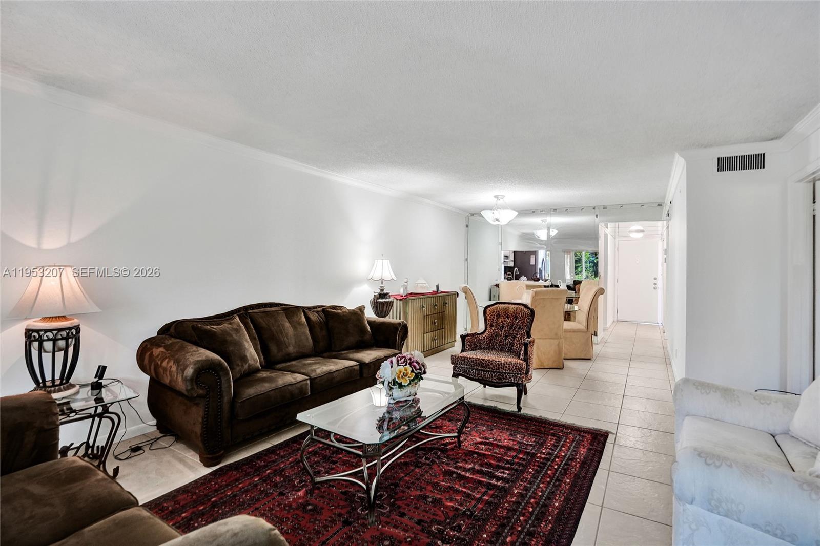 3511 Inverrary Drive, Unit 107 Lauderhill, FL 33319 - Photo 26 of 47 a living room with furniture and a rug
